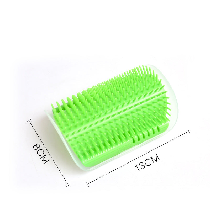Cat self-grooming wall brush next to a ruler for scale