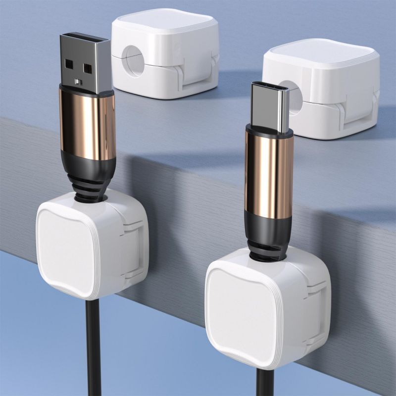 Magnetic cable clips holding multiple cables together