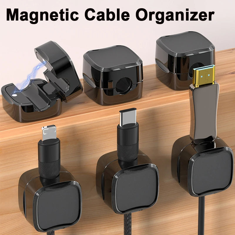 Magnetic cable clips holding a phone charging cord