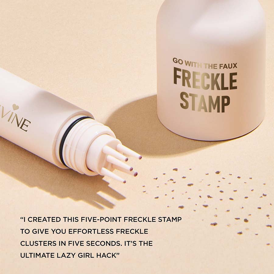 Waterproof freckle stamp pen held in hand